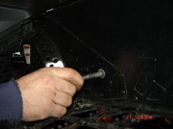 Remove the two rear suspension bolts.