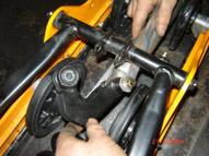 Remove stock rocker arm mounted to front Arm